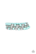 Load image into Gallery viewer, A collection of polished blue, shiny silver, and faceted crystal-like beads are threaded along stretchy bands, creating colorful layers around the wrist.  Sold as one set of three bracelets

