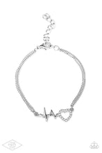 Load image into Gallery viewer, Reminiscent of a heartbeat, a wavy silver bar attaches to a charming heart silhouette for a simply beautiful display. Dazzling white rhinestones are sprinkled along the heart charm for a sparkling finish. Features an adjustable clasp closure.  Sold as one individual bracelet.
