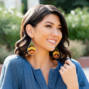 Colorful sections of shiny Olive Branch, mustard, and Adobe threads decoratively weave along arched silver bars inside of a shiny silver teardrop, resulting into an earthy lure. Earring attaches to a standard fishhook fitting.