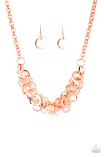 Countless shiny copper rings dangle from a shiny copper chain, creating a clustered fringe below the collar. Features an adjustable clasp closure.