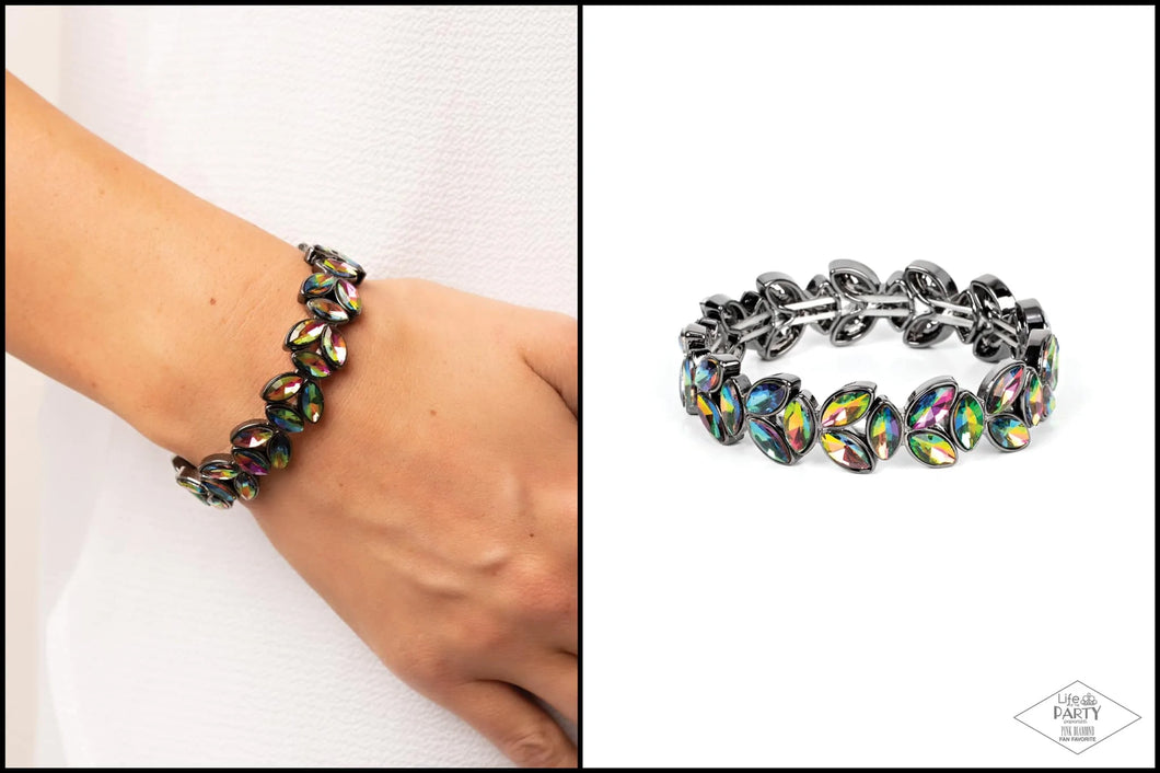 Featuring a stellar oil spill finish, trios of marquise cut rhinestones delicately join into leafy gunmetal frames along a stretchy band, creating a refined display around the wrist.  Sold as one individual bracelet.  New Kit FANFAVORITE