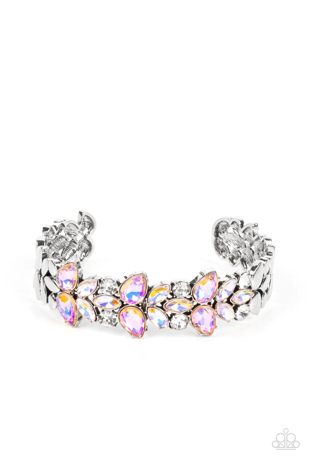 Iridescent coral teardrop and iridescent peach marquise gems converge with classic white rhinestones to create a subtle floral motif across the front of a silver cuff. The prismatic accents add an air of mystery to the piece, while smooth flattened silver discs border the gleaming gems in a high sheen finish. Due to its prismatic palette, color may vary.  Sold as one individual bracelet.
