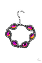 Load image into Gallery viewer, Bordered in gunmetal frames dotted with tiny flecks of hematite rhinestones, a collection of asymmetrical gems coated in an oil-spill finish delicately link into a spellbinding sparkle around the wrist. Features an adjustable clasp closure. Due to its prismatic palette, color may vary.
