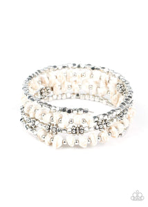 An earthy collision of white stone beads, silver cubes, and decorative silver accents are threaded along a silver wire that coils around the wrist, creating a whimsical infinity wrap bracelet.  Sold as one individual bracelet.