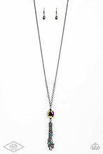 Load image into Gallery viewer, Featuring an oil spill finish, a faceted oil spill gem attaches to the bottom of a lengthened gunmetal chain featuring sections of airy chain links. Infused with dainty gunmetal and matching oil spill beads, shimmery gunmetal chains stream from the bottom of a hematite dotted cap, creating an edgy tassel. Features an adjustable clasp closure.  Sold as one individual necklace. Includes one pair of matching earrings.
